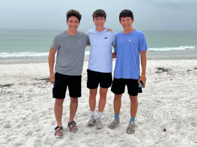 Three young men at the beach